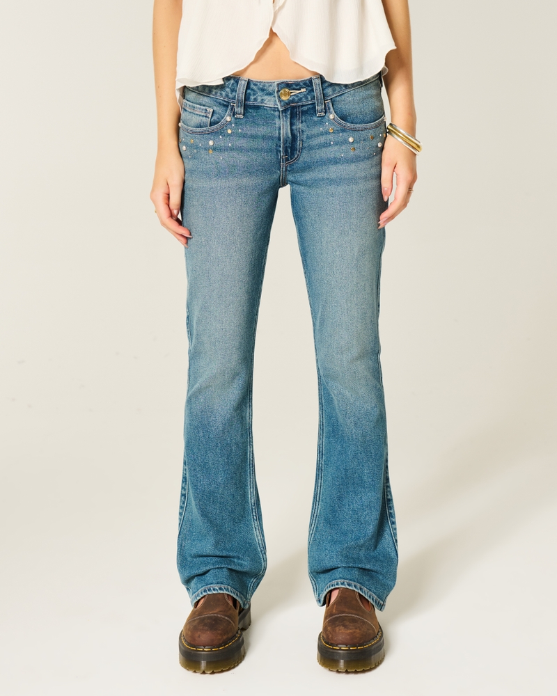 hüftig geschnittene leicht abgenutzte bootcut-jeans in mittlerer waschung