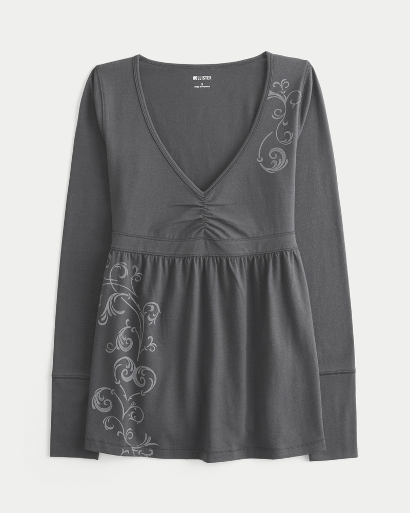 babydoll-top mit langen Ärmeln rüschenoberteil und brustmuster.