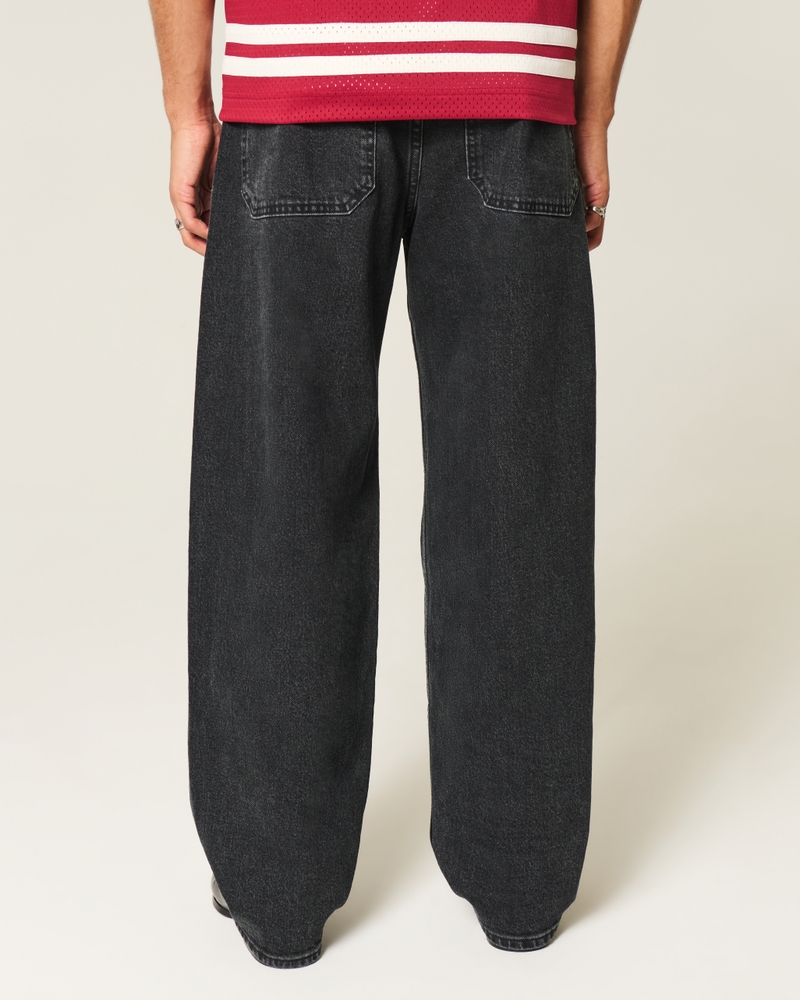 schwarze gewaschene jeans im skateboard-stil mit schlangenstickerei und lockerer passform