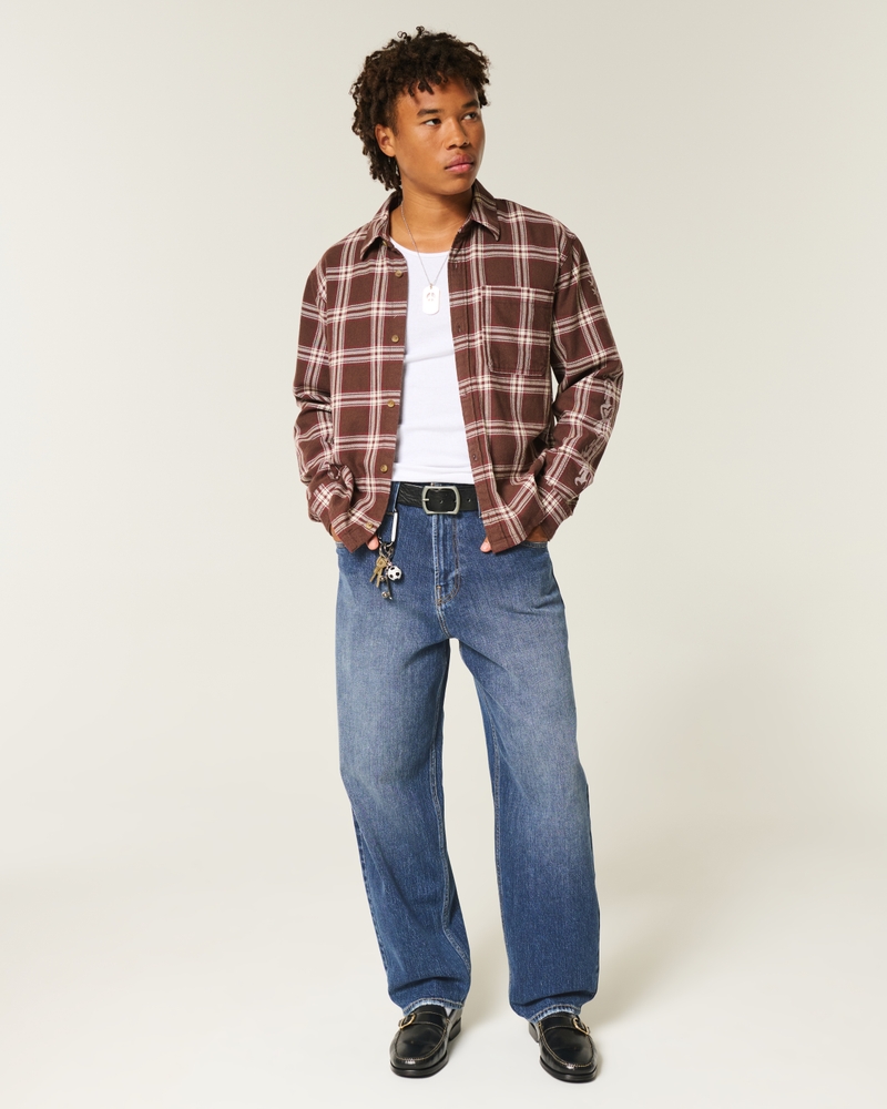 schwarze gewaschene jeans im skateboard-stil mit schlangenstickerei und lockerer passform